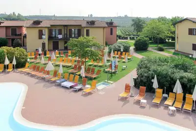 Image de Appartement avec Wifi, piscine, climatisation, bain à remous, Tv, terrasse, animaux admis, parking