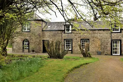 Image de The Stables bénéficie d'un emplacement calme et privé dans le parc d'Arbigland House