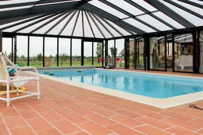 Image de Joli appartement dans une maison de vacances avec piscine, Wifi, Tv, patio, animaux admis, parking