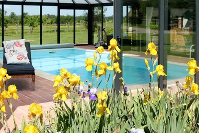 Image de Joli appartement dans une maison de vacances avec piscine, Wifi, Tv, patio, animaux admis, parking
