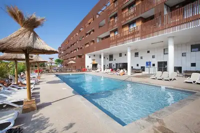 Image de Apparts Communicants Près de la Plage | Accès Sauna + Salle de Fitness