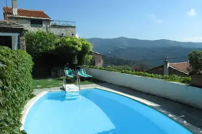 Image de Bel appartement dans une maison de vacances avec Wifi, piscine, Tv, patio, vue panoramique, parking