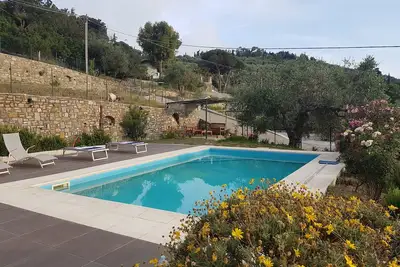 Image de App. in semi-detached villa private garden and parking shared pool