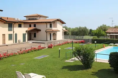Image de Agréable appartement avec Wifi, climatisation, piscine, Tv, patio, animaux admis et parking
