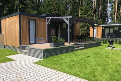 Image de Mobil home moderne au bord du lac avec sauna tonneau (Wa104)