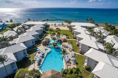Image de Ocean front ground floor corner unit on famous Cayman Islands Seven Mile Beach.