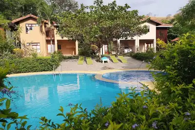Image de Villa avec piscine dans condominium tranquilo, para familias y cerca de las playas