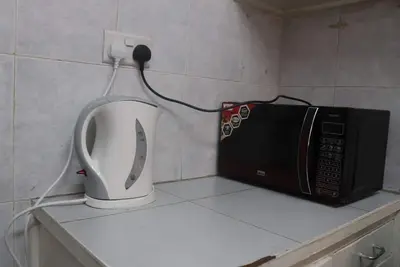 Image de Appartement maison pourpre, avec télévision par câble, Netflix et WiFi. À distance de marche du Cbd
