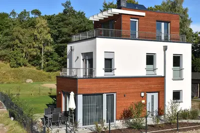 Image de Naturpark-Ferienhaus-See-Fasssauna-Kamin-5 étoiles-110m² - maison de vacances Egret