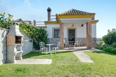 Image de \"Casas Rurales El Mirador A\" avec une piscine partagée, des vues magnifiques.
