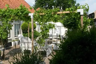 Image de Maison de vacances \"Engel van de Molen\" pour couples avec terrasse, jardin et Wi-Fi