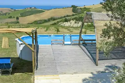 Image de Appartement dans une maison de vacances avec piscine, climatisation, Wifi, bain Ă remous, Tv, patio
