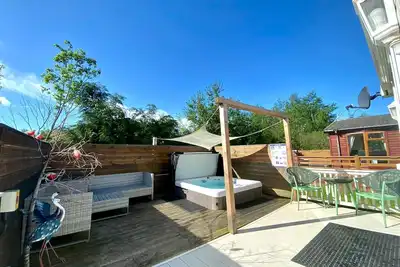 Image de Woody’s Retreat - magnifique lodge de 2 chambres pouvant accueillir 4 personnes