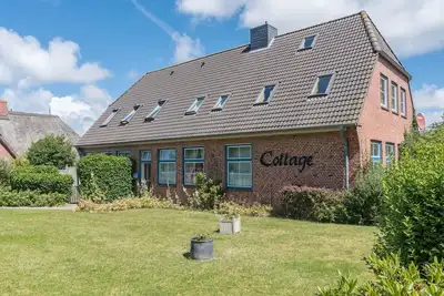 Image de Appartement de vacances \"Cottage am Watt\" à l'estran avec Wi-Fi et terrasse