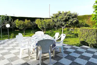 Image de Villa 'Incantevole Maddalena' avec terrasse partagée et jardin privé