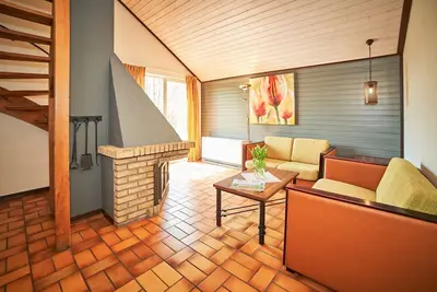 Image de Linked bungalow for four people, simply decorated.