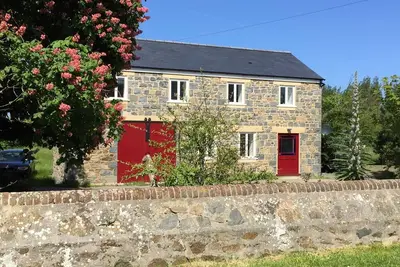 Image de Architecte converti en grange en granit, 5 étoiles d'or
