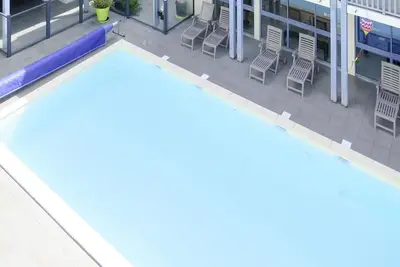 Image de Confortable appartement avec Wifi, bain à remous, piscine, Tv, terrasse, animaux admis et parking