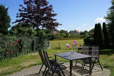 Image de A holiday home where everyone will immediately feel at home. The homely appearance is a mix of modern design and coziness. The house is located in the front section of the popular North Sea Park, but due to its unique location, it offers a lot of pea