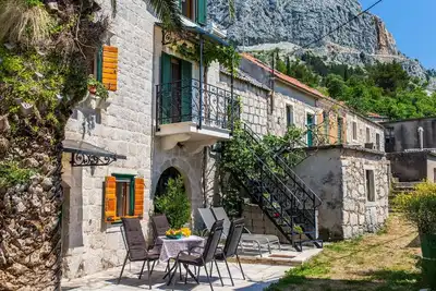 Image de Maison de vacances Podgora pour 1 - 4 personnes avec 2 chambres à coucher - Maison jumelée