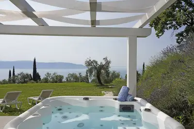 Image de CĂ Bianca sotto: in the middle of the nature with jacuzzi and lake view