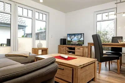 Image de Haus Kirsten - Here the wind blows around your nose! Semi-detached house with ap