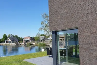 Image de Vacation home right on the lake with sauna, air conditioning and private beach