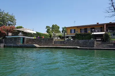 Villa with jetty on Magra river