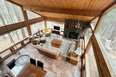 Image de Lodge-style multi-level home at the Homestead in Glen Arbor. Deck with grill.