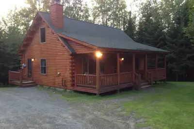 Entire private beautifuly fully appointed  log cabin with Shared Lake Frontage.