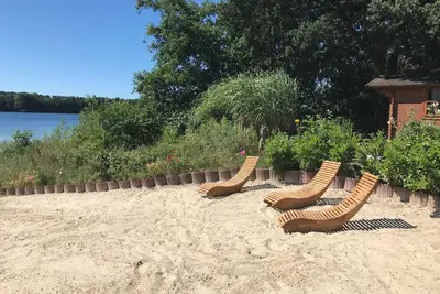 Image de Haus am See - House by the lake, idyllic and comfortable, max 10 p. , 85-107 sqm private sandy beach on the