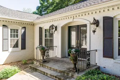 Expansive ranch on private wooded lot! E Cobb