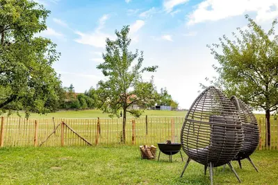 Image de Haus GrĂĽn in a secluded location on the edge of the forest with fenced garden, fireplace and infrared cabin