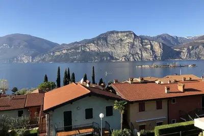 Vacation home with private garden, lake and mountain views near the eastern shore of the lake.