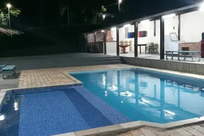 Image de Villa in Santana de ParnaĂba with adult and children's pool.