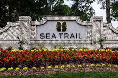 Image de 4 Bedroom 2200 sq ft beautiful Sea Trail Golf Resort 5 minutes to ocean waves!