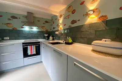 Image de Vacation home close to the beach with wood-burning stove, terrace
