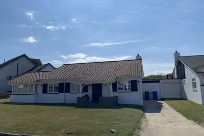 Beadnell Fantastic Bungalow - garden backs straight onto dunes and beach.