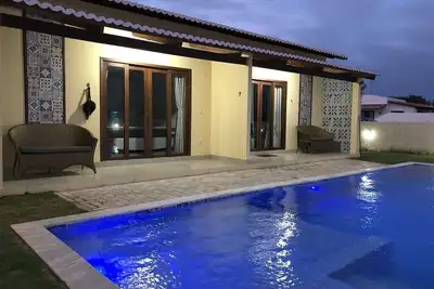 Image de Perto Da Praia\/cond. fechado, completo, novo, piscina, churrasqueira e Muito Sossego