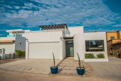 Breathtaking Custom Home in Sandy Beach with Great Amenities!