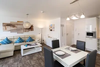 Image de Modern apartment, close to the beach with balcony, parking space, Wlan. Pets allowed.