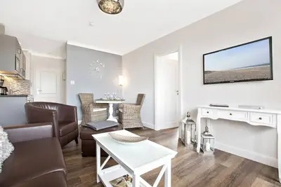 Image de 2-room apartment close to the beach: balcony, parking space, Wlan. Pets allowed.