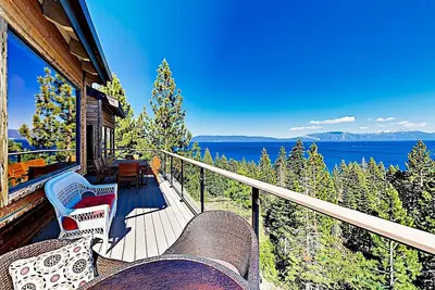 Image de Just above the waters of Meeks Bay, this remarkable home offers unobstructed 180-degree lake views.