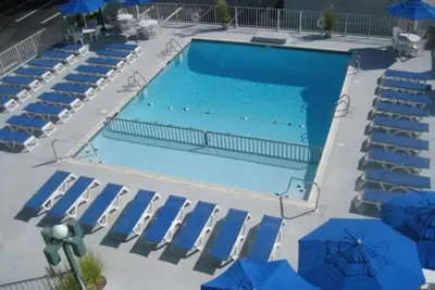 Image de Beach and Boards with a Pool.