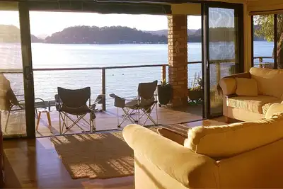 Image de Waterfront! Stunning boat access only home. Deep water jetty. Sunset views