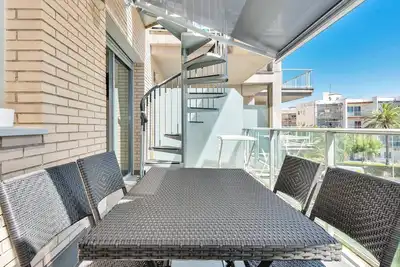 Image de Appartement sur la plage avec solarium privé