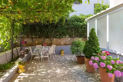 Image de Appartement de vacances avec barbecue et air conditionné