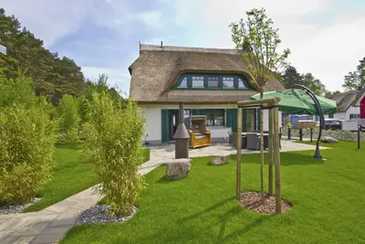 Image de House in a great location with garden, terrace and private sauna - Ferienhaus Seehund