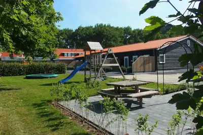 Image de Modern, child-friendly, luxury holiday home in Oostkapelle, for six people, with a playground in front of the door
