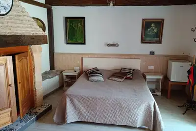 Image de Chambre avec aceès au terrain et à la piscine